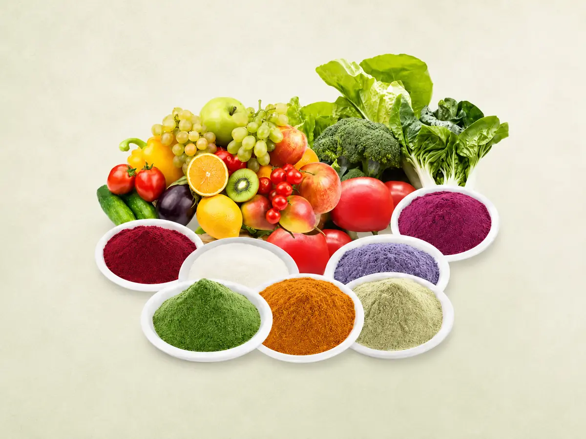 Fresh fruits and vegetables with colorful fruit and vegetable powders