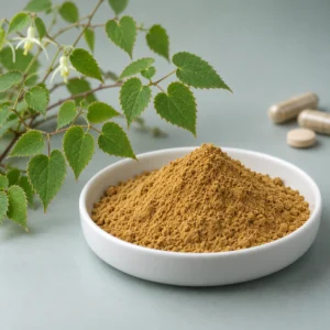 Brown-yellow Icariin powder beside compound Epimedium foliage with capsules and a tablet in the background
