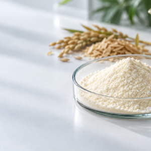White to pale-yellow Natural Ferulic Acid powder in a glass dish with rice bran in the background