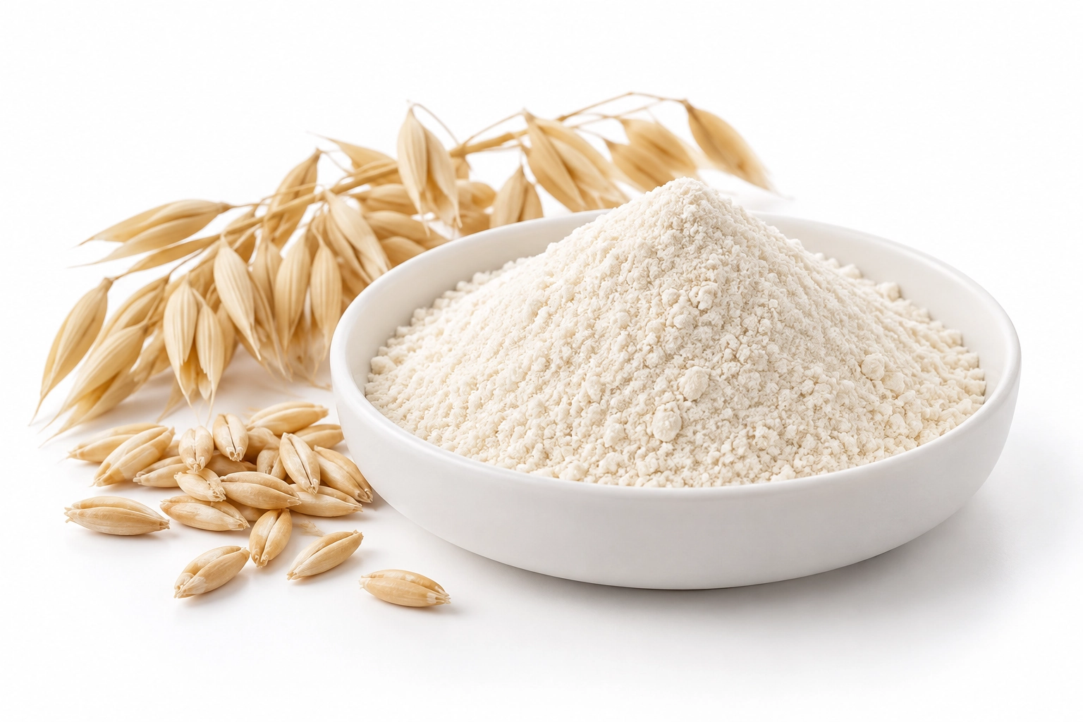 Off-white oat beta-glucan powder in a white dish beside oat grains and oat heads on a white background